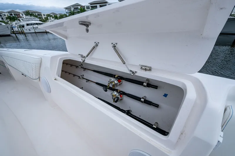 Slide: The Image of 2020 Intrepid 407 Panacea boat with open fishing rod storage compartment. - 30