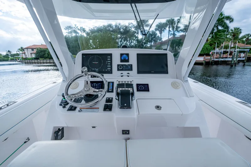 Slide: The Image of 2020 Intrepid 407 Panacea helm with advanced navigation systems and sleek design. - 4