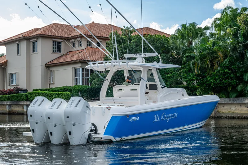 Slide: The Image of 2020 Intrepid 407 Panacea boat with triple engines on a scenic waterway. - 49