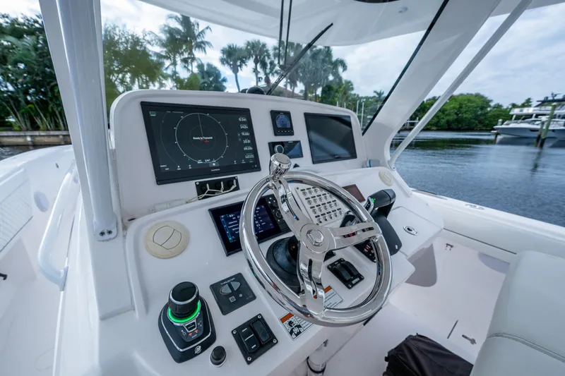Slide: The Image of Helm of 2020 Intrepid 407 Panacea with advanced navigation controls and displays. - 5