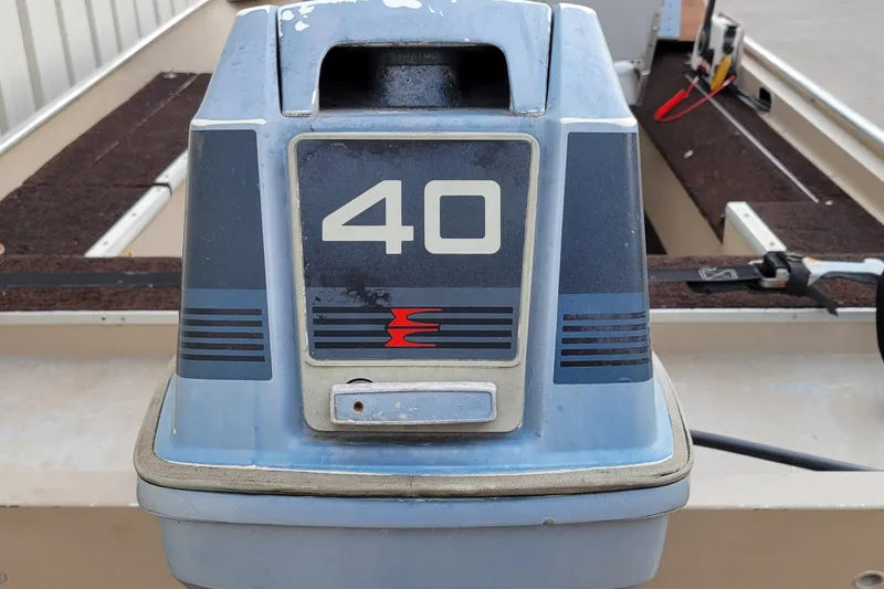 Slide: The Image of 1987 Alumacraft Classic 165 CS boat with a 40 HP outboard motor. - 10