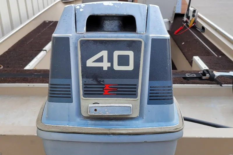 Slide: The Image of 1987 Alumacraft Classic 165 CS boat with a 40 HP outboard motor. - 11