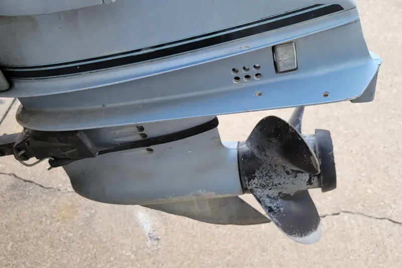 Slide: The Image of Close-up of a 1987 Alumacraft Classic 165 CS boat motor propeller. - 13