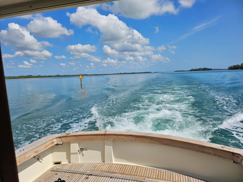 Slide: The Image of View from the deck of a 1991 Donzi 65 Sportfisherman cruising on a sunny day. - 11