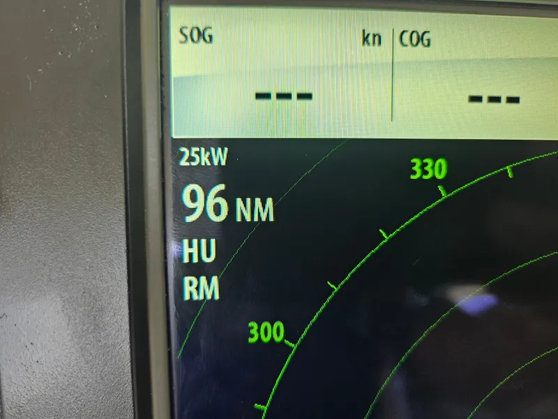 Slide: The Image of Radar display on a 1991 Donzi 65 Sportfisherman showing 96 NM range. - 14