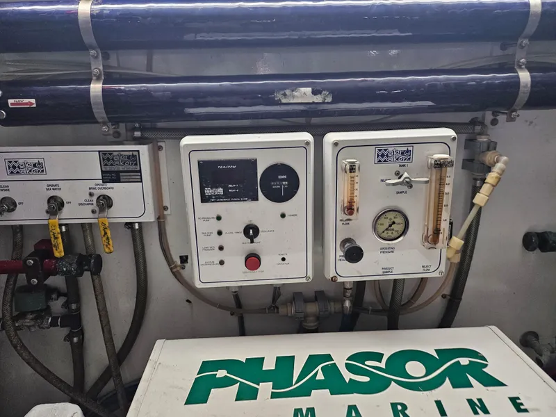 Slide: The Image of Control panel and equipment in the engine room of a 1991 Donzi 65 Sportfisherman. - 25