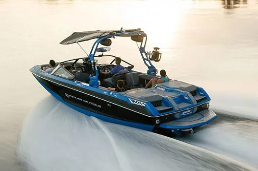Slide: The Image of Manufacturer Provided Image: 2021 Nautique Super Air Nautique GS22 speeding on water at sunset. - 15