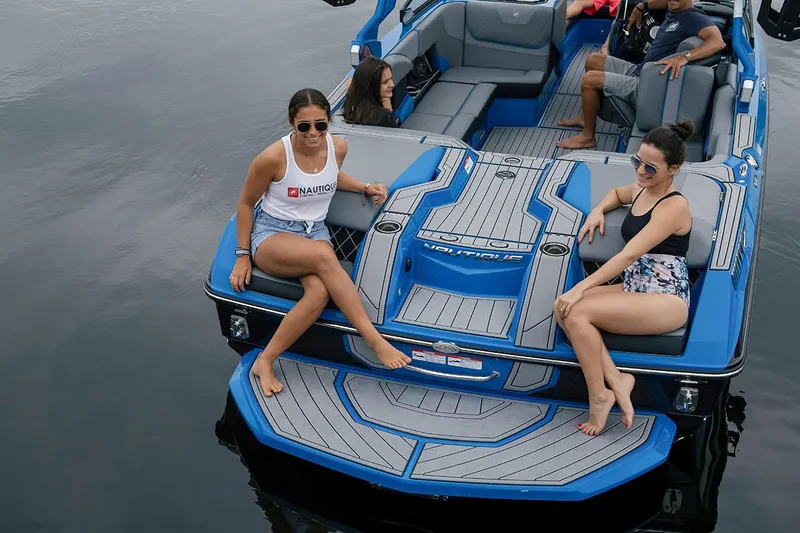 Slide: The Image of Manufacturer Provided Image: 2021 Nautique Super Air Nautique GS22 with passengers enjoying the water. - 18