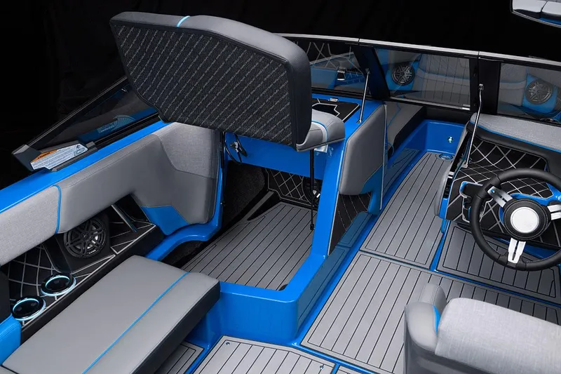 Slide: The Image of Manufacturer Provided Image: 2021 Nautique Super Air Nautique GS22 interior with blue and gray seating and modern dashboard. - 21