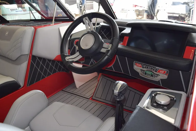 Slide: The Image of 2021 Nautique Super Air Nautique GS22 interior with modern dashboard and steering wheel. - 9