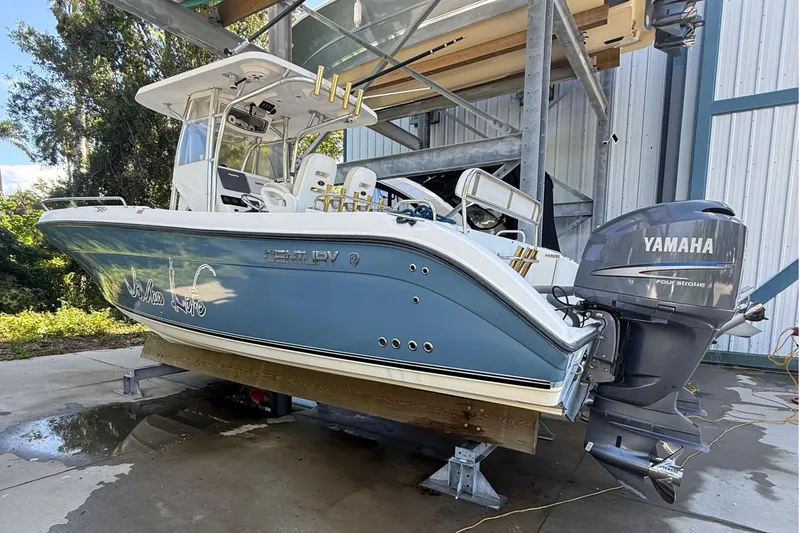 Slide: The Image of 2008 Century 2901 Center Console boat with Yamaha engine, docked outdoors. - 1