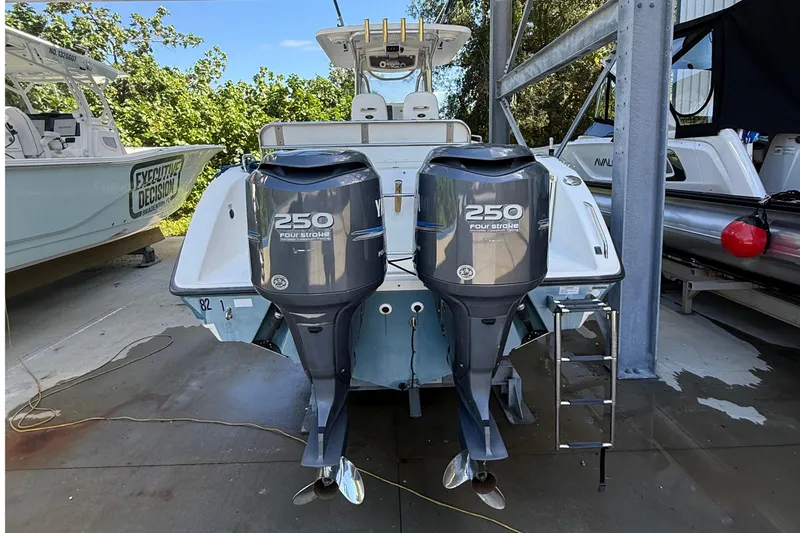 Slide: The Image of 2008 Century 2901 Center Console with twin Yamaha 250 four-stroke engines in a marina. - 11