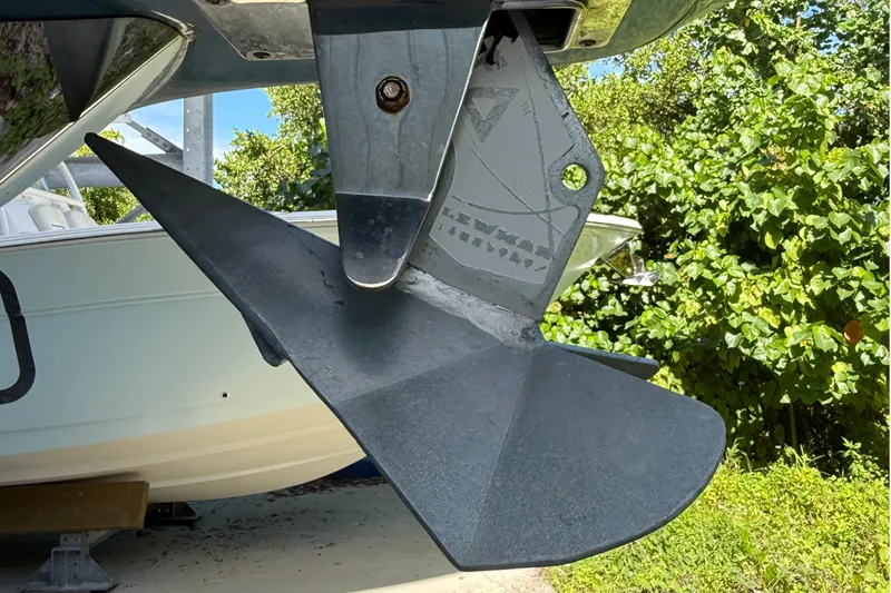 Slide: The Image of Close-up of a 2008 Century 2901 Center Console boat's anchor against greenery. - 12