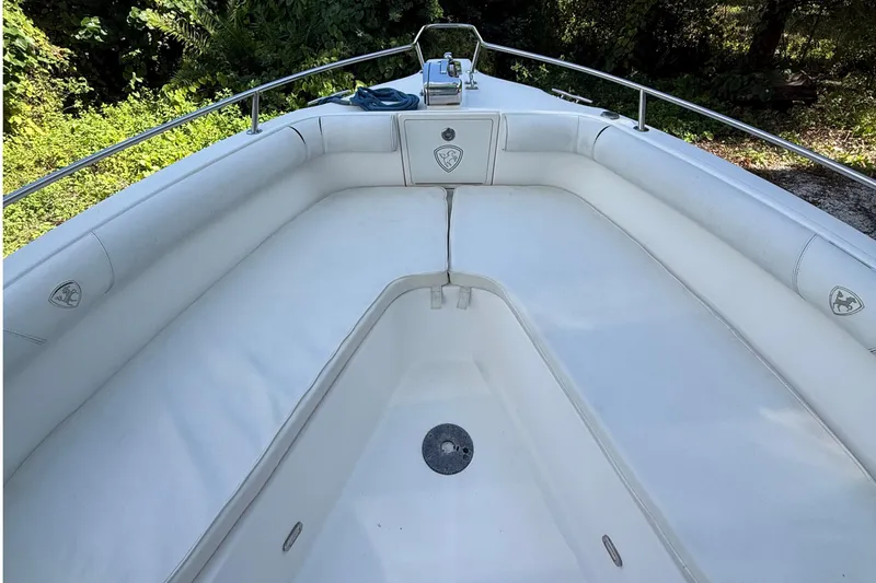 Slide: The Image of 2008 Century 2901 Center Console boat with white cushioned seating and stainless steel railings. - 13
