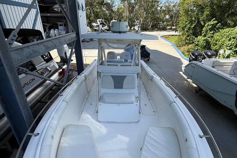 Slide: The Image of 2008 Century 2901 Center Console boat docked, featuring spacious seating and modern design. - 17