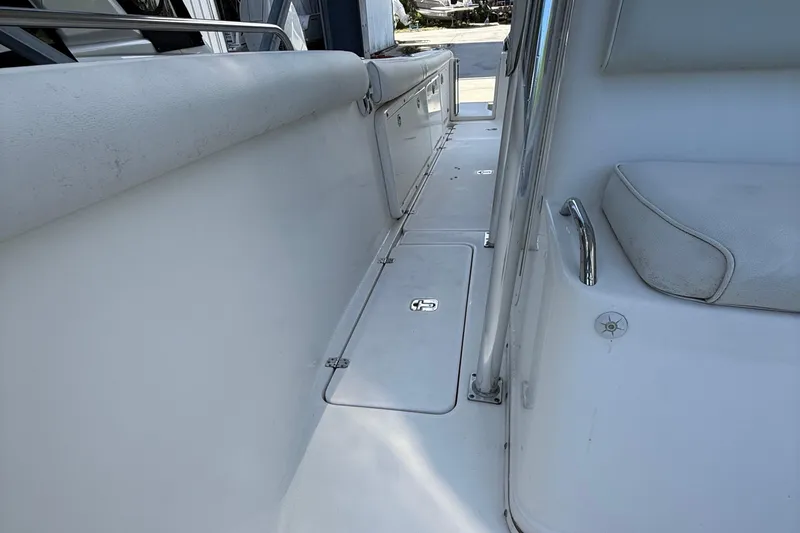 Slide: The Image of 2008 Century 2901 Center Console boat interior with seating and storage compartments. - 19