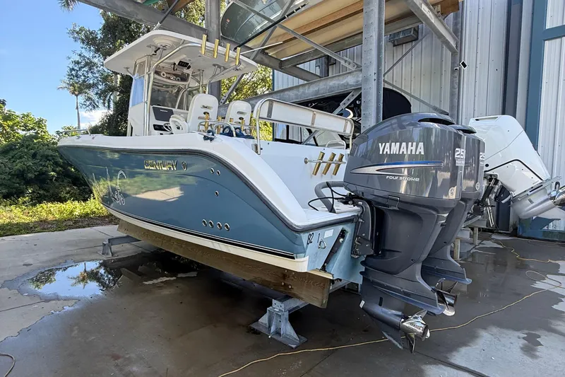 Slide: The Image of 2008 Century 2901 Center Console boat with Yamaha engines, docked outdoors. - 2