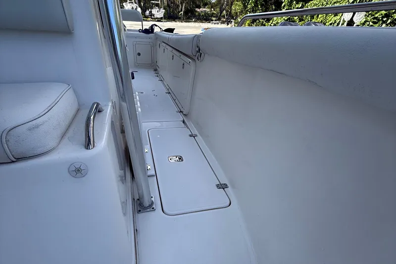 Slide: The Image of 2008 Century 2901 Center Console boat interior with seating and storage compartments. - 20