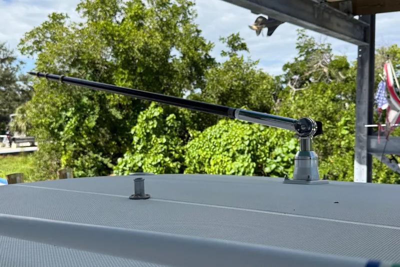 Slide: The Image of Antenna on 2008 Century 2901 Center Console boat, surrounded by lush greenery. - 26