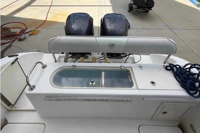 Slide: The Image of 2008 Century 2901 Center Console boat with dual engines and fishing equipment. - 53