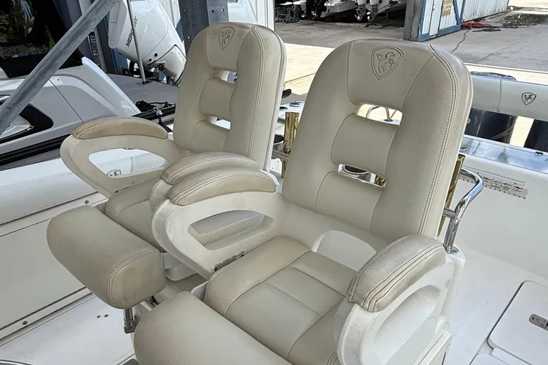 Slide: The Image of Luxurious seating on a 2008 Century 2901 Center Console boat, featuring plush white upholstery. - 57