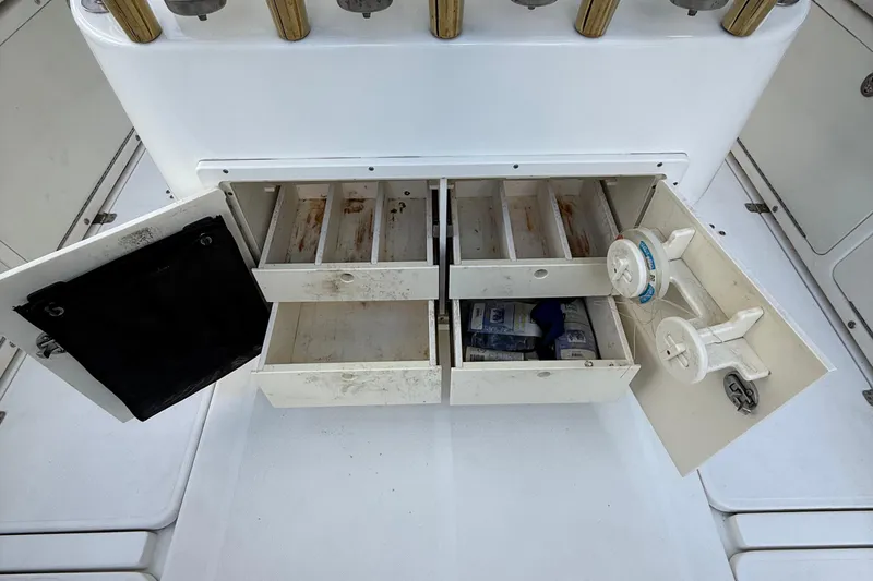 Slide: The Image of Open storage compartments on a 2008 Century 2901 Center Console boat. - 59