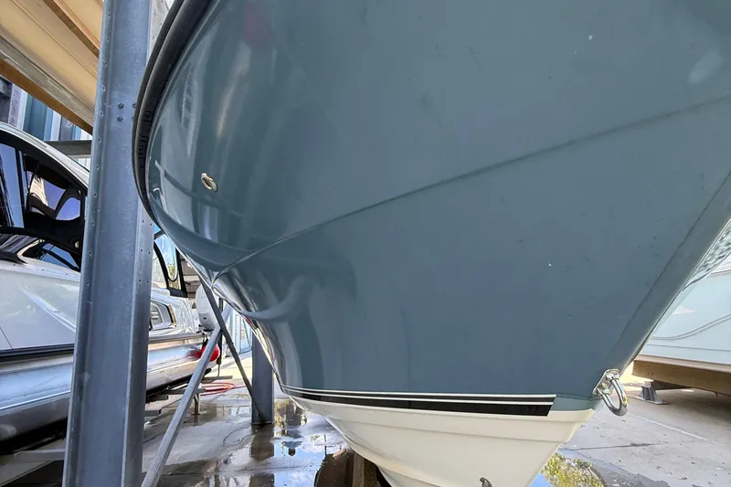 Slide: The Image of 2008 Century 2901 Center Console boat hull in storage, side view. - 7