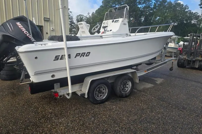 The Image of 2007 Sea Pro 190 Center Console boat on trailer, parked outdoors. - 1