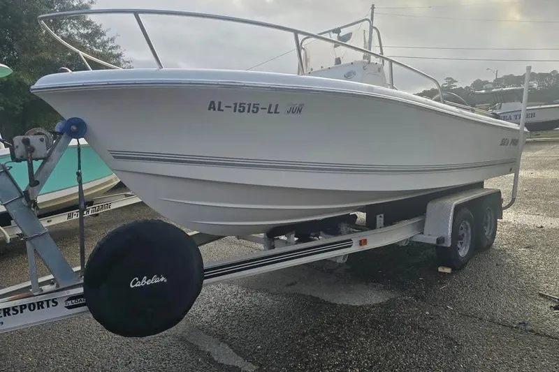Slide: The Image of 2007 Sea Pro 190 Center Console boat on trailer, parked outdoors. - 2