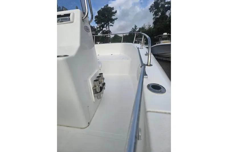 Slide: The Image of 2007 Sea Pro 190 Center Console boat deck with railing and rod holders. - 4
