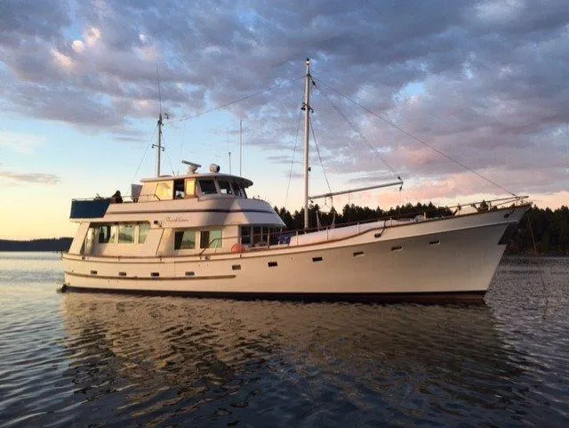Slide: The Image of 1982 Miller Marine North Sea Trawler Ed Monk on calm water at sunset. - 11