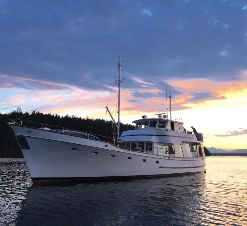 Slide: The Image of 1982 Miller Marine North Sea Trawler at sunset on calm waters. - 3