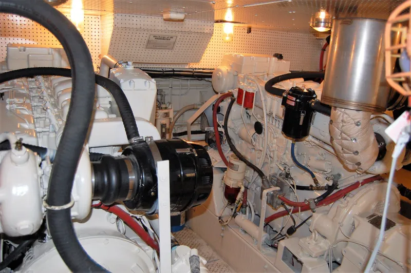 Slide: The Image of Engine room of 1982 Miller Marine North Sea Trawler, featuring complex machinery and piping. - 31