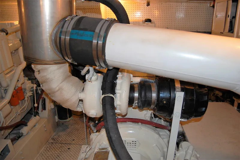 Slide: The Image of Engine room of 1982 Miller Marine North Sea Trawler, featuring exhaust and piping system. - 34