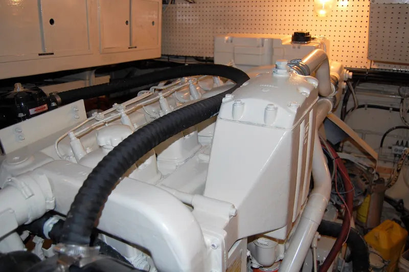Slide: The Image of Engine room of 1982 Miller Marine North Sea Trawler, showcasing mechanical components and piping. - 35