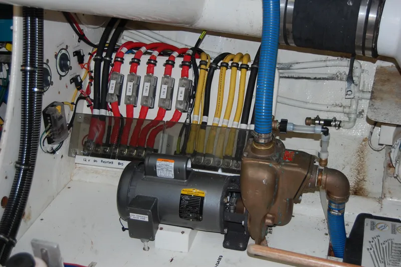Slide: The Image of Engine room of 1982 Miller Marine North Sea Trawler, featuring electrical wiring and machinery. - 36