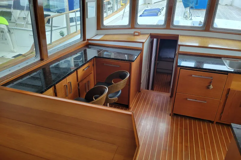 Slide: The Image of Interior of 1982 Miller Marine North Sea Trawler with wood finish and granite countertops. - 48