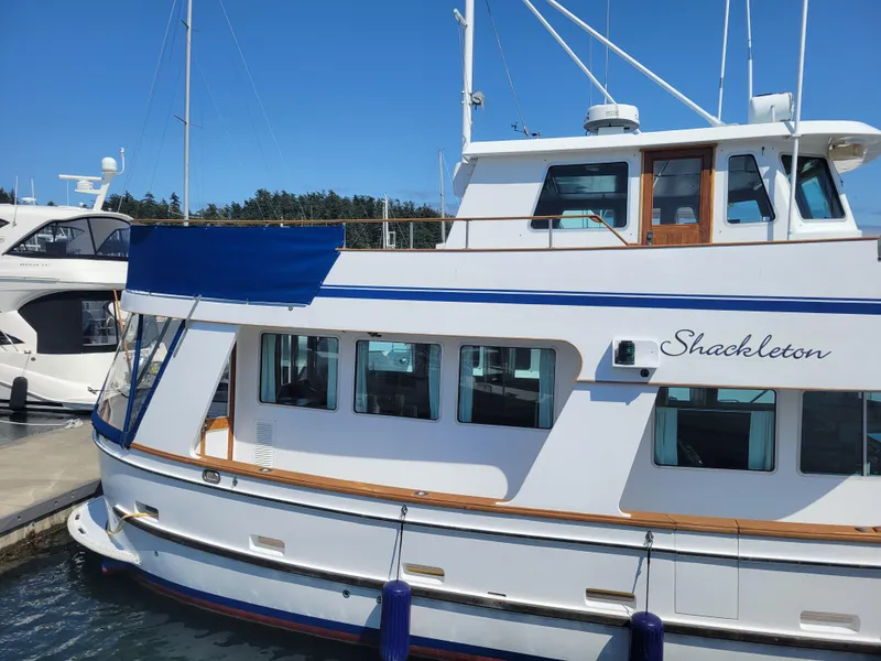 Slide: The Image of 1982 Miller Marine North Sea Trawler docked, featuring classic design and "Shackleton" name. - 5