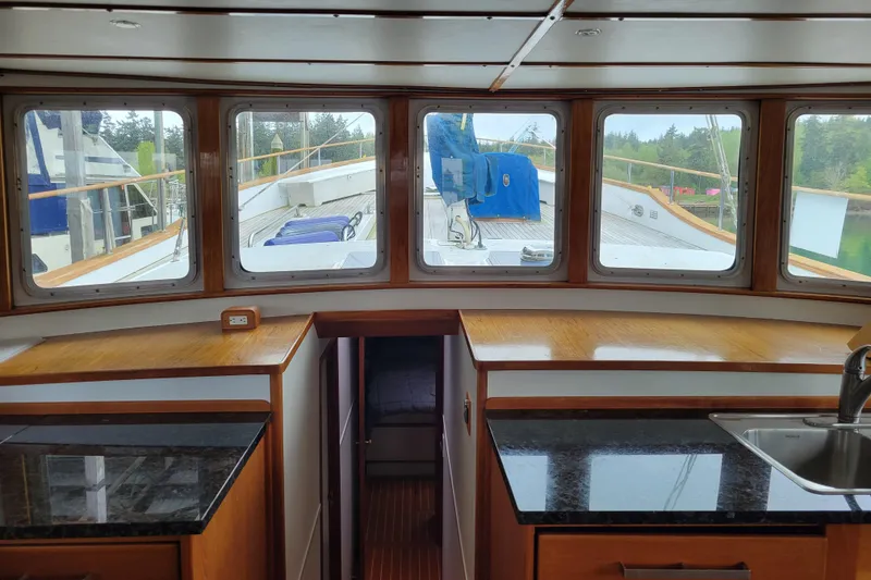 Slide: The Image of Interior view of 1982 Miller Marine North Sea Trawler, showcasing windows and countertops. - 56