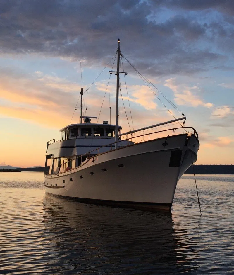 Slide: The Image of 1982 Miller Marine North Sea Trawler at sunset on calm waters. - 8