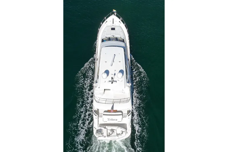 Slide: The Image of Aerial view of 2005 Marquis 65 yacht cruising on open water. - 16