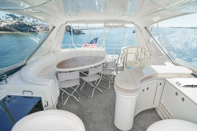 Slide: The Image of Luxurious 2005 Marquis 65 yacht interior with elegant seating and ocean view. - 27
