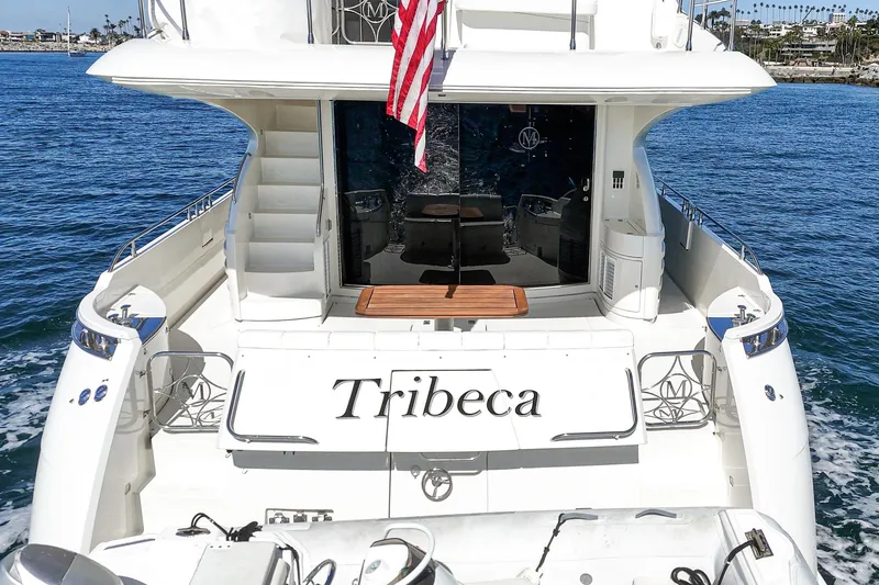 Slide: The Image of Luxury yacht "Tribeca" on water, 2005 Marquis 65 model, rear view with American flag. - 36