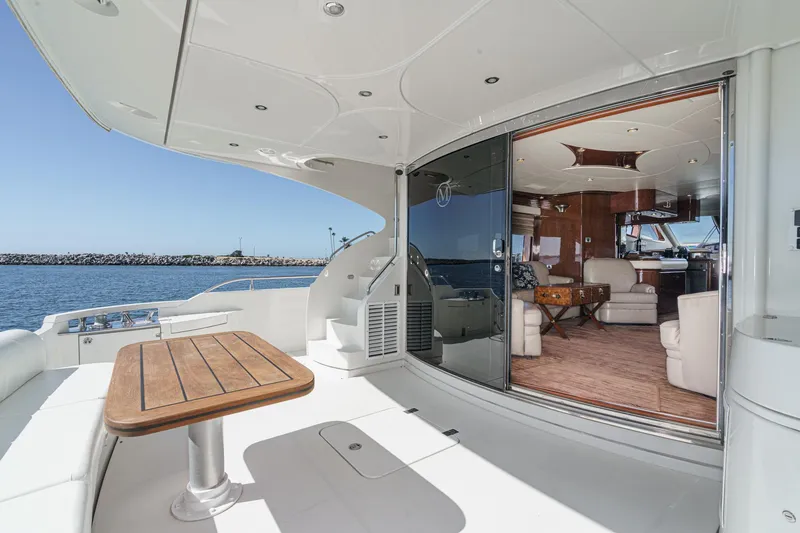 Slide: The Image of Luxurious 2005 Marquis 65 yacht with elegant interior and spacious deck overlooking the ocean. - 38
