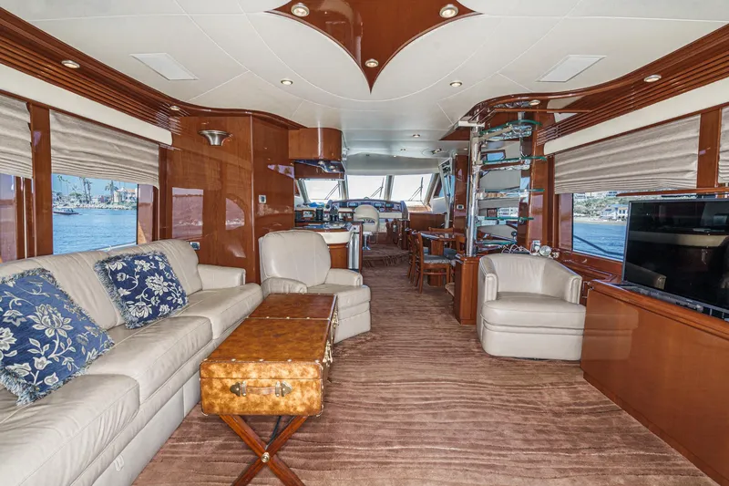 Slide: The Image of Luxurious interior of a 2005 Marquis 65 yacht with elegant furnishings and panoramic windows. - 47