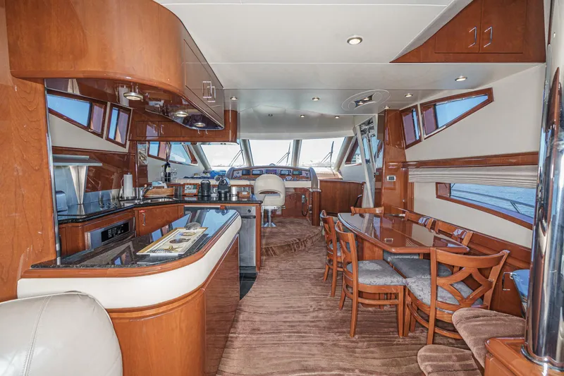 Slide: The Image of Luxurious interior of a 2005 Marquis 65 yacht with elegant wood finishes and modern amenities. - 49