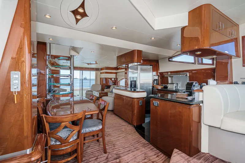 Slide: The Image of Luxurious interior of a 2005 Marquis 65 yacht with elegant wood finishes and modern amenities. - 50