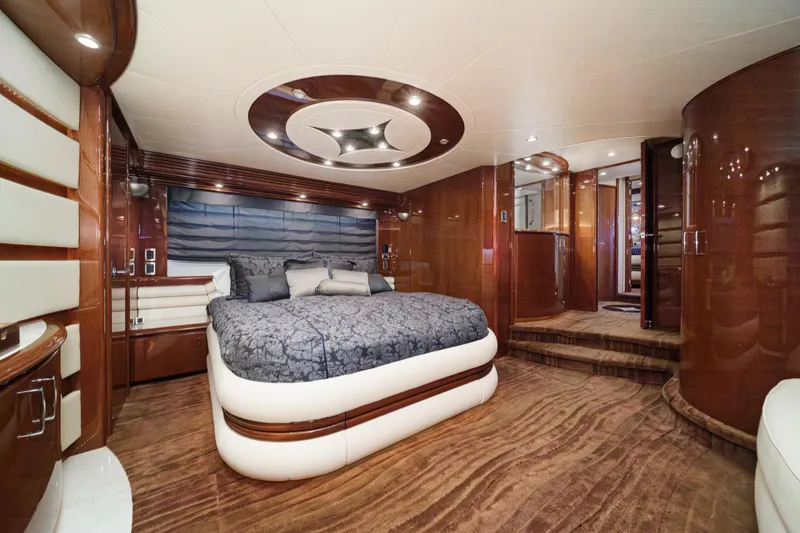 Slide: The Image of Luxurious bedroom interior of 2005 Marquis 65 yacht with elegant wood finishes and modern design. - 59
