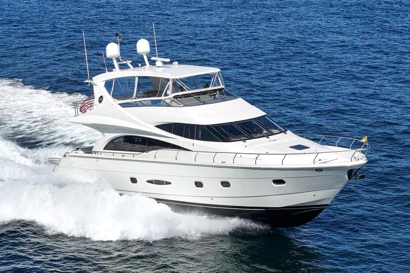 Slide: The Image of Luxury 2005 Marquis 65 yacht cruising on open sea. - 6