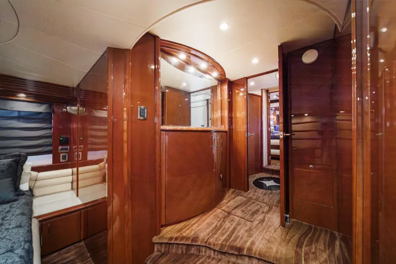 Slide: The Image of Luxurious interior of a 2005 Marquis 65 yacht with polished wood finishes. - 61